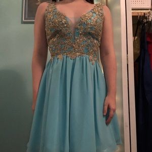 short blue dress w/ gold detailing at top